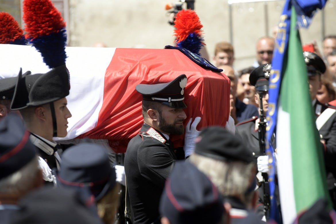 Italy mourns slain officer as politicians debate treatment of American suspect