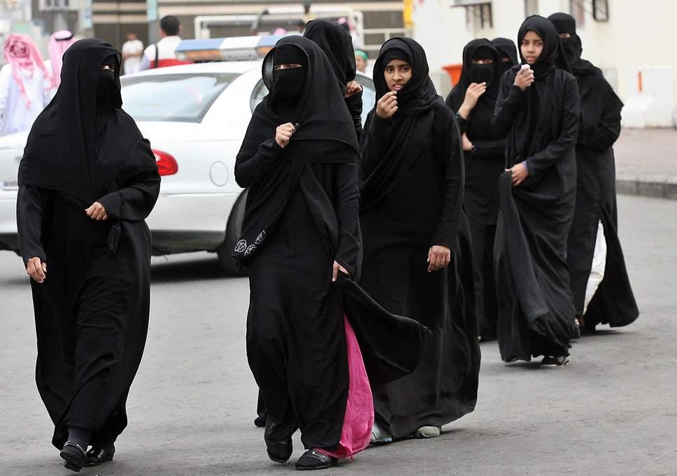 Challenging the state, Saudi women wear their abayas inside out
