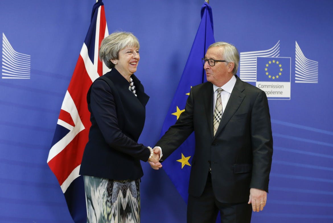 May walks a tightrope as Brexit talks falter