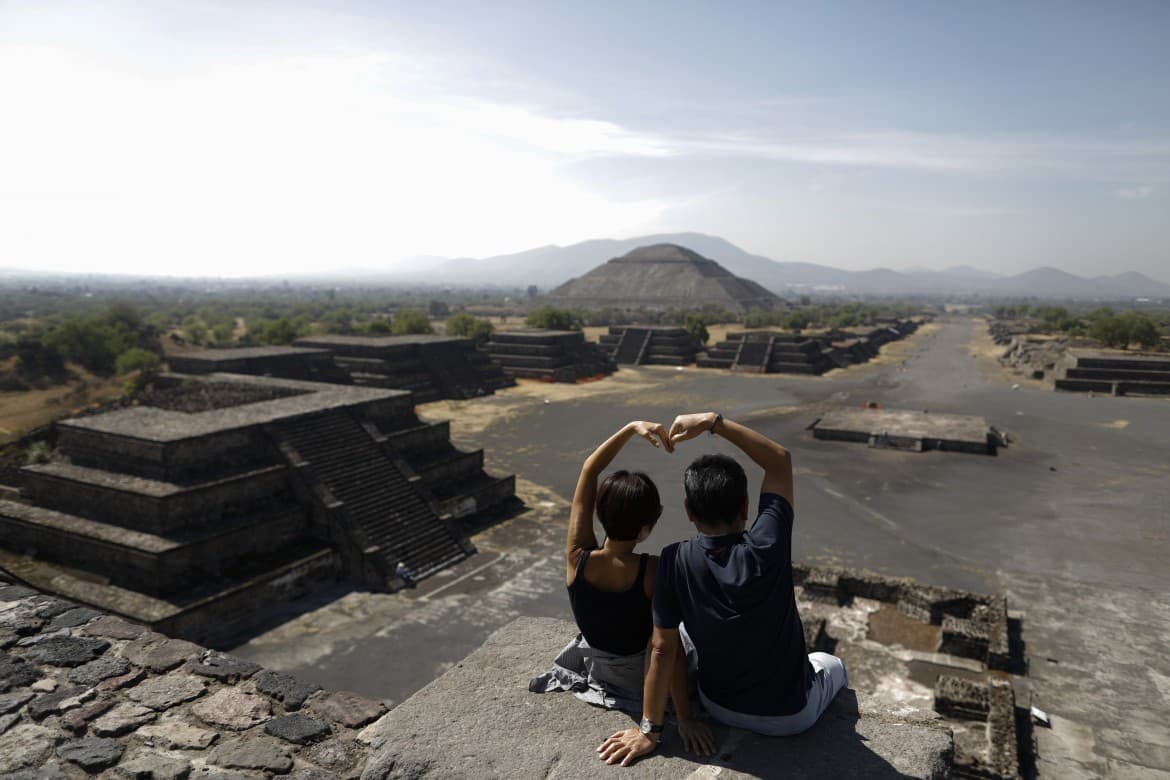 A storm is coming, but Mexican beaches and festivals are packed and life continues