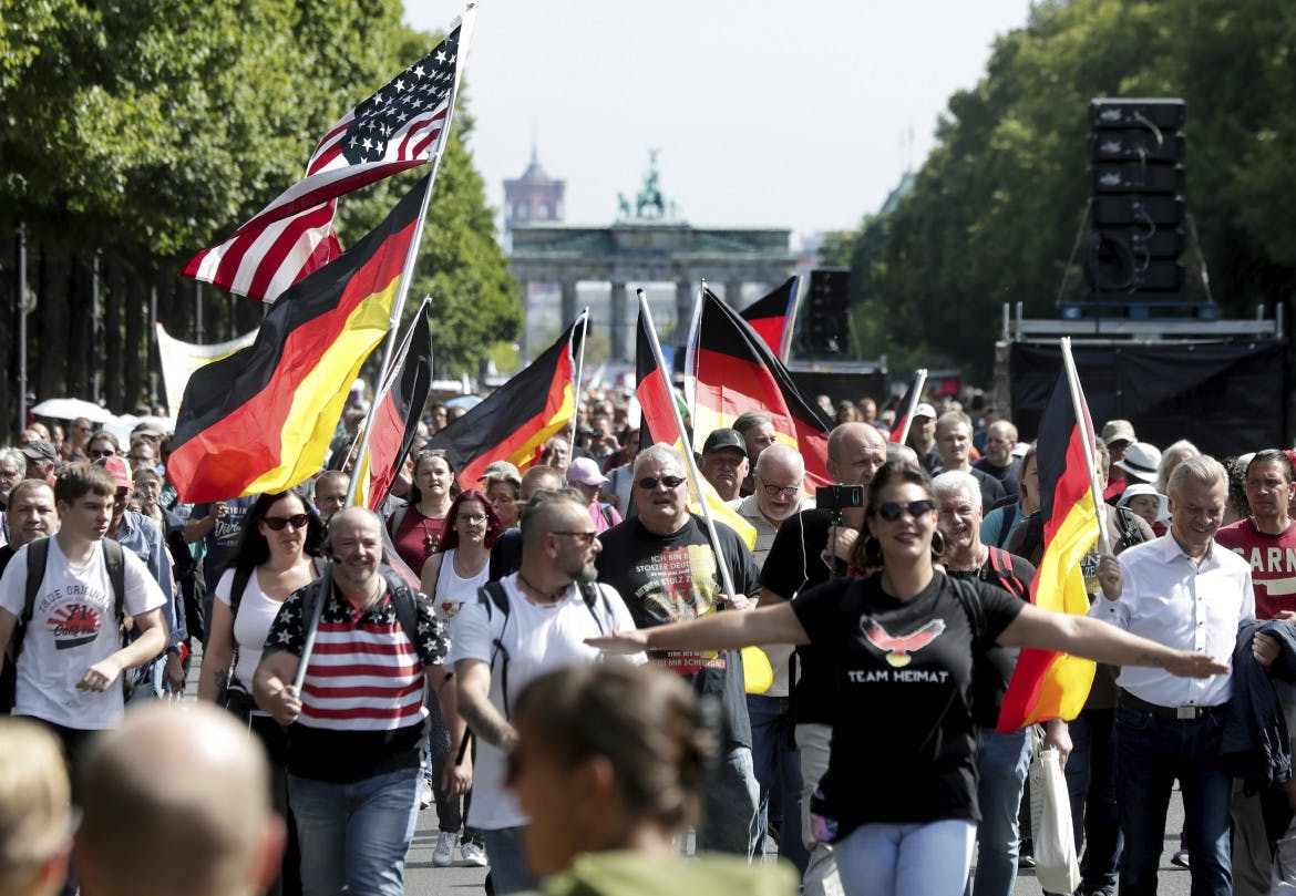 Anti-vaxxers and QAnon believers marched on the German capital without masks