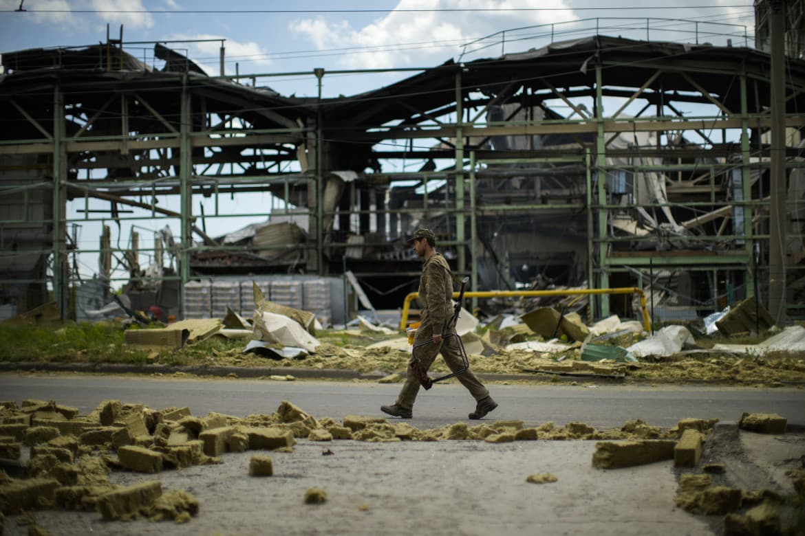 Bombs whistle through the skies of Lyshichansk, a zombie city