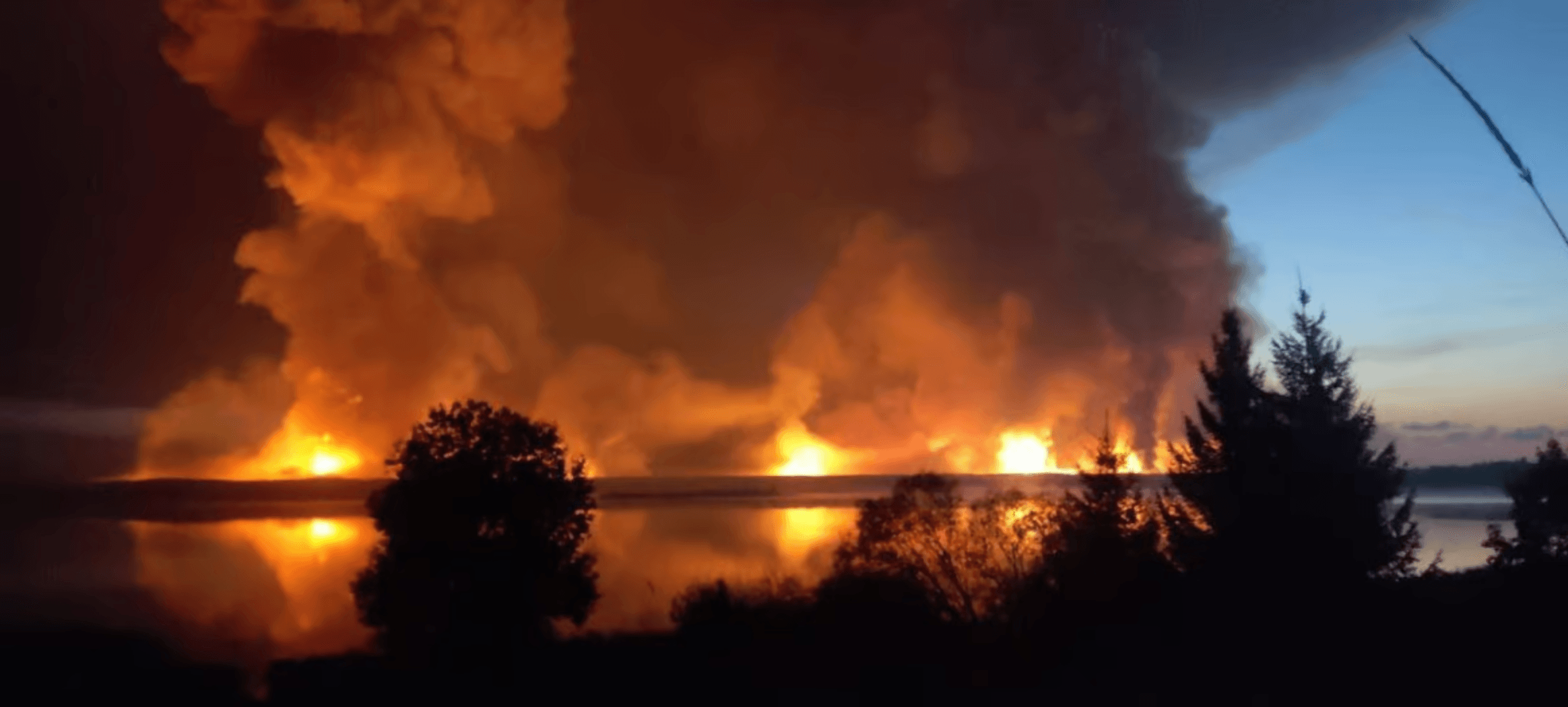 Ukrainian soldiers celebrate a strategic win, the explosion of a Russian ammunition depot