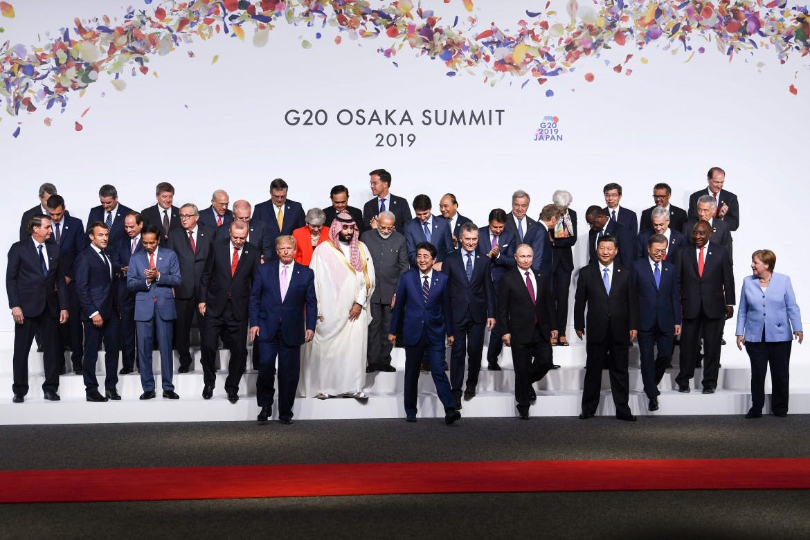 At the G20, a group photo with a murderer