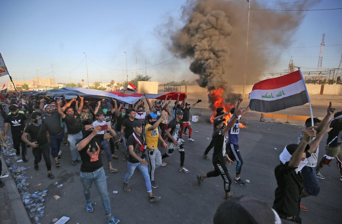 image of iraqis marching in protest