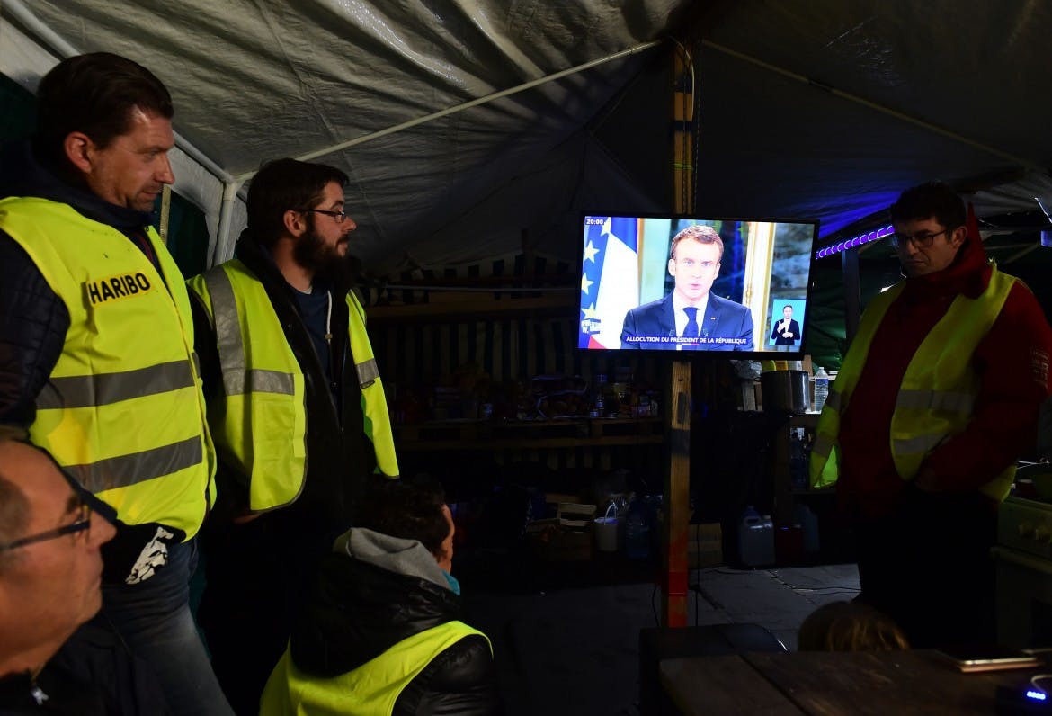 Macron attempts to calm revolt, but dissent remains