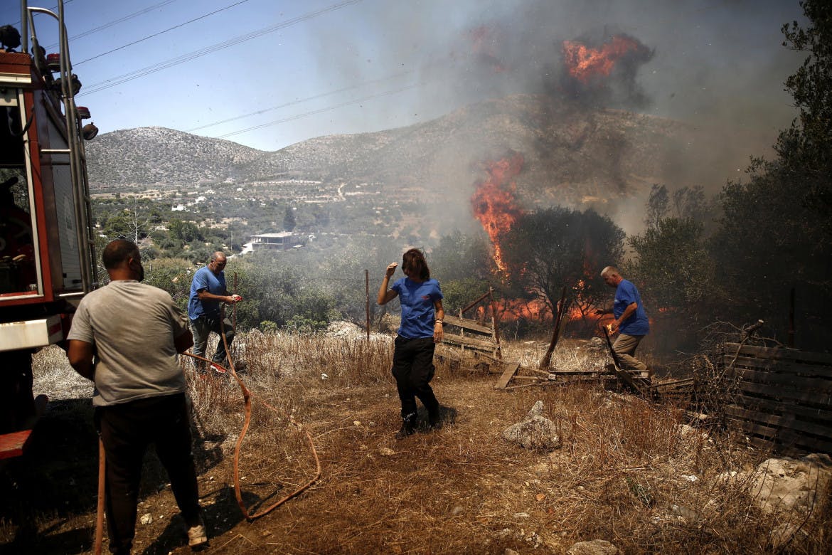 In the Greek inferno, Rhodes burns and thousands of tourists flee
