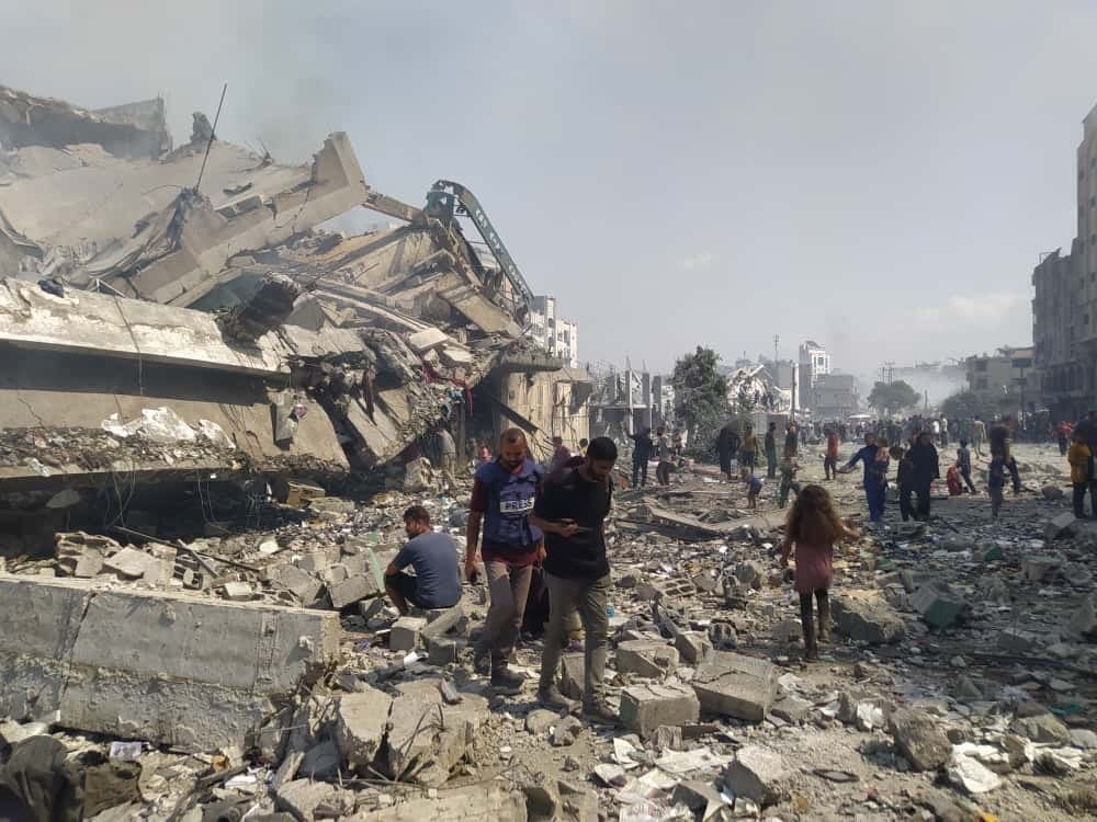 Bulldozers are paving over the ruins of Gaza with the bodies still inside